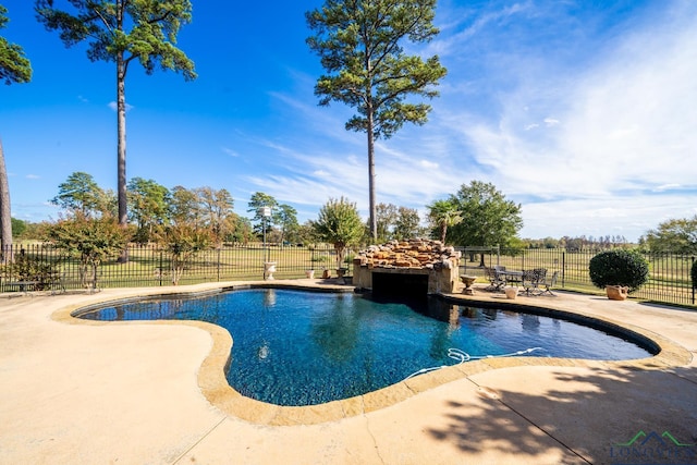 view of pool featuring a fenced in pool, a patio area, and fence