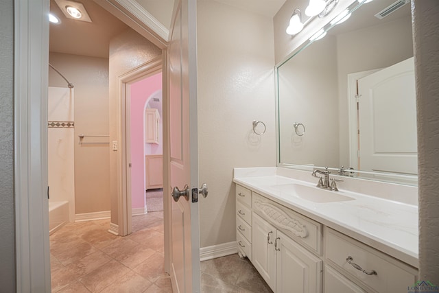 full bathroom featuring shower / tub combo, baseboards, visible vents, and vanity