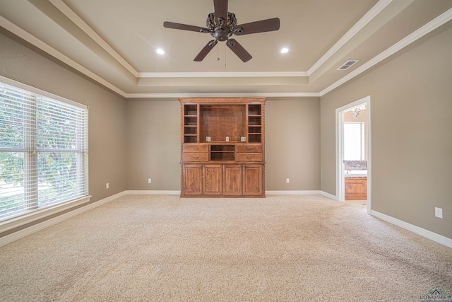 unfurnished room with baseboards, visible vents, a raised ceiling, light colored carpet, and recessed lighting