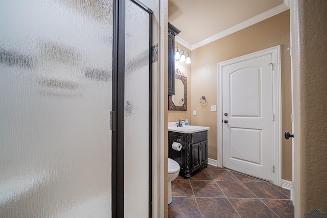 full bath featuring a stall shower, baseboards, toilet, crown molding, and vanity