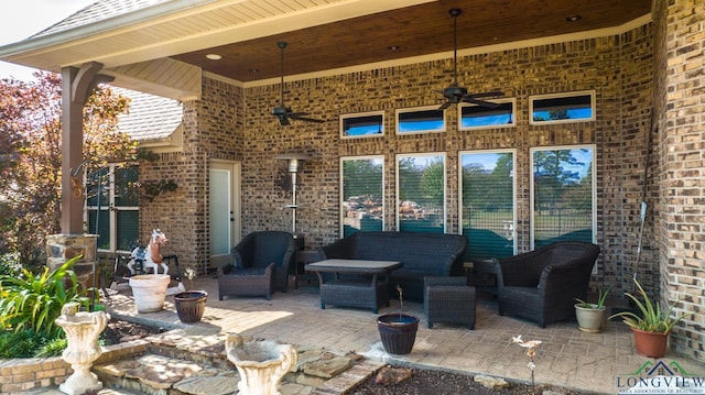 view of patio / terrace featuring ceiling fan and outdoor lounge area