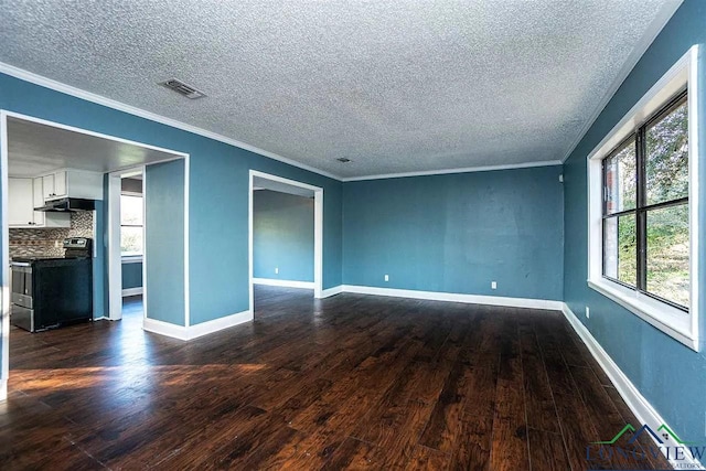 unfurnished room with baseboards, dark wood-style floors, visible vents, and crown molding