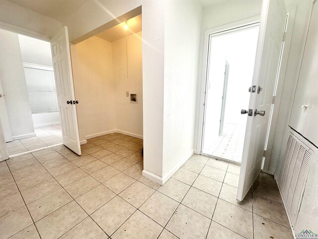 1435 Tom Smith Rd, Harleton, TX 75651 - entrance foyer featuring light tile patterned floors and baseboards