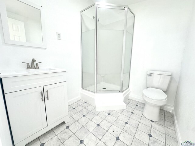 1435 Tom Smith Rd, Harleton, TX 75651 - bathroom with baseboards, vanity, toilet, a shower stall, and tile patterned flooring
