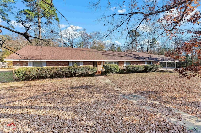 exterior space with a carport