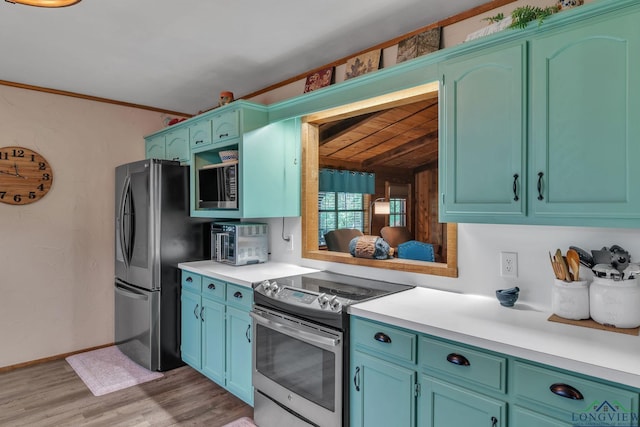 kitchen with light wood-type flooring, stainless steel appliances, beamed ceiling, light countertops, and wooden ceiling