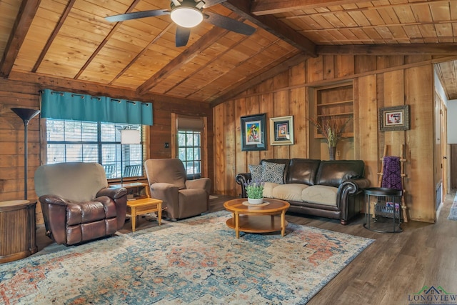living area with a ceiling fan, wood ceiling, wood finished floors, wood walls, and vaulted ceiling with beams