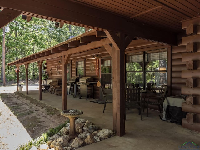 view of patio with a grill