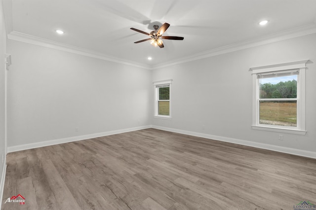 unfurnished room with ceiling fan, ornamental molding, and light hardwood / wood-style floors