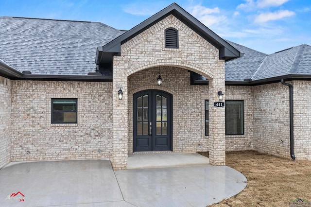 entrance to property with french doors and a patio area