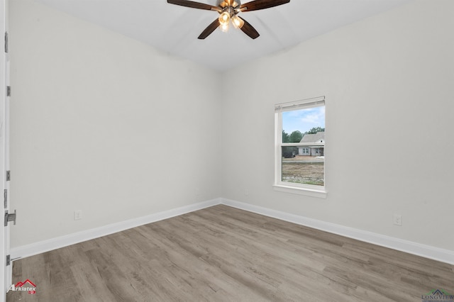 empty room featuring ceiling fan and light wood-type flooring