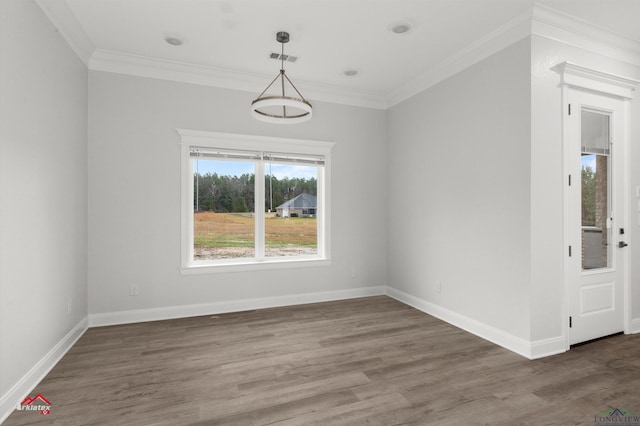 spare room with dark hardwood / wood-style flooring and crown molding