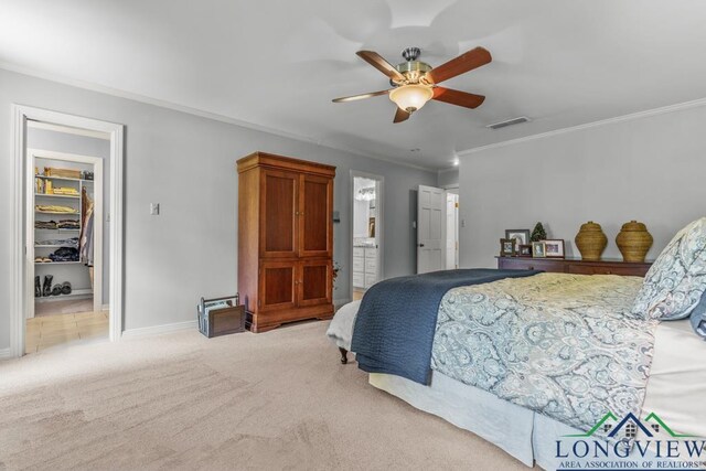 1805 Greenway St, Gilmer, TX 75644 - bedroom with a spacious closet, carpet, crown molding, a closet, and ceiling fan