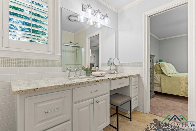 1805 Greenway St, Gilmer, TX 75644 - bathroom featuring connected bathroom, vanity, a shower stall, tile patterned floors, and crown molding