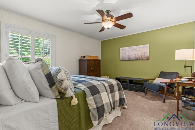 1805 Greenway St, Gilmer, TX 75644 - bedroom with crown molding, carpet, and a ceiling fan
