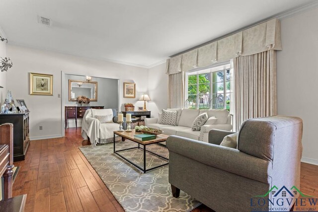 1805 Greenway St, Gilmer, TX 75644 - living room featuring ornamental molding, wood-type flooring, and baseboards