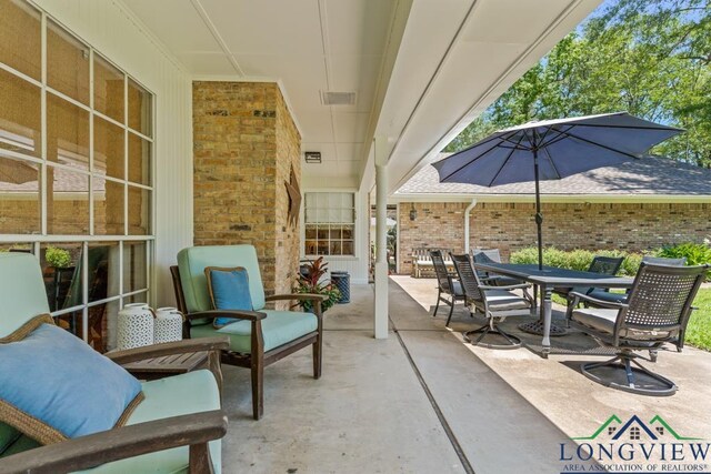 1805 Greenway St, Gilmer, TX 75644 - view of patio with outdoor dining area