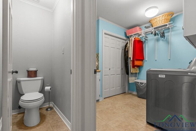 1805 Greenway St, Gilmer, TX 75644 - laundry area with washer / clothes dryer, ornamental molding, light tile patterned floors, and baseboards