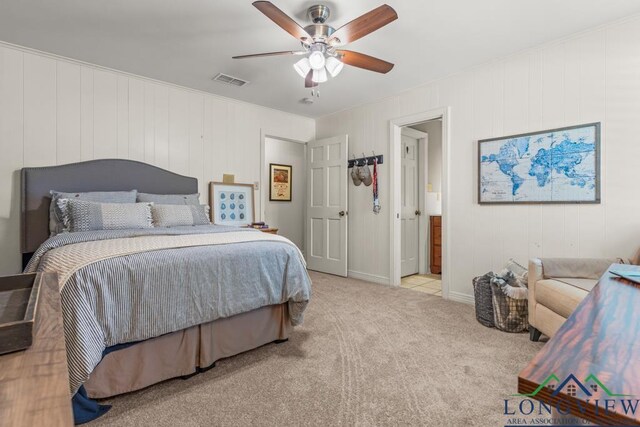 1805 Greenway St, Gilmer, TX 75644 - carpeted bedroom with a ceiling fan, connected bathroom, and baseboards