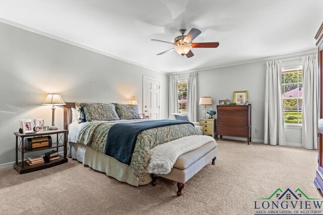 1805 Greenway St, Gilmer, TX 75644 - bedroom with light colored carpet, multiple windows, crown molding, and baseboards
