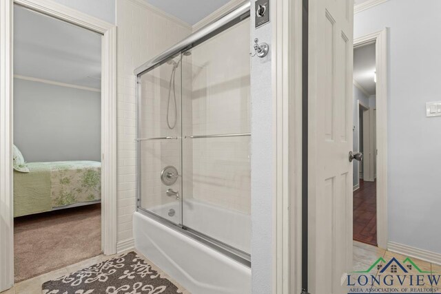 1805 Greenway St, Gilmer, TX 75644 - ensuite bathroom with bath / shower combo with glass door and crown molding