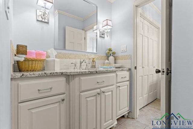 1805 Greenway St, Gilmer, TX 75644 - bathroom with crown molding, vanity, tile patterned floors, and tasteful backsplash