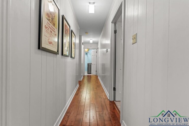 1805 Greenway St, Gilmer, TX 75644 - hallway with dark wood-type flooring and baseboards