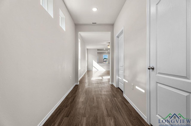 hallway with dark wood-type flooring