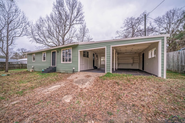 single story home with a carport