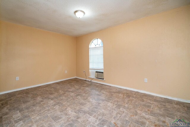 809 Herbert St, Marshall, TX 75670 - spare room featuring a textured ceiling and baseboards