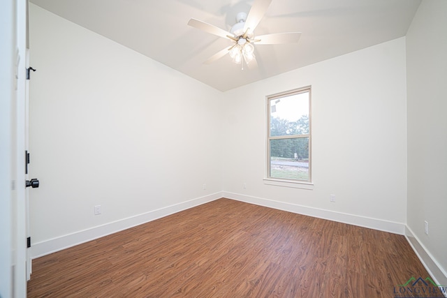 unfurnished room featuring dark hardwood / wood-style floors and ceiling fan