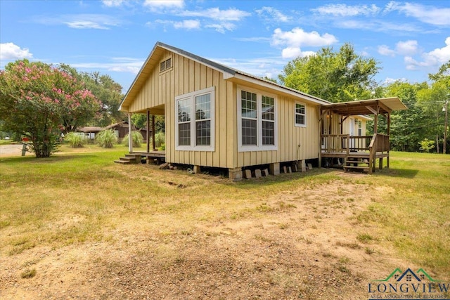 1150 Fm 139, Joaquin, TX 75954 - view of property exterior with a wooden deck and a yard