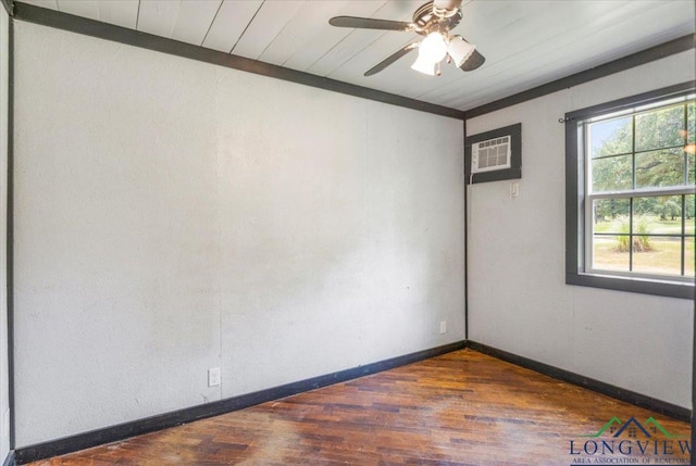 1150 Fm 139, Joaquin, TX 75954 - spare room with an AC wall unit, wood finished floors, and ceiling fan