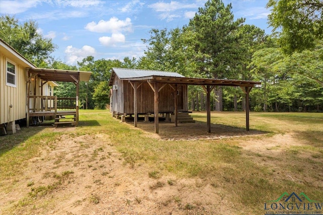 1150 Fm 139, Joaquin, TX 75954 - view of green lawn with a deck and an outbuilding