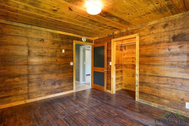1150 Fm 139, Joaquin, TX 75954 - empty room featuring wooden ceiling, wood walls, and dark wood-style flooring
