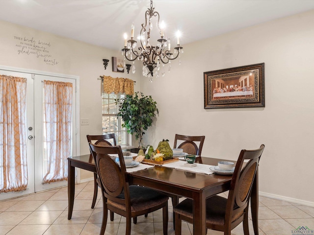 2888 Fm 593, Gilmer, TX 75644 - dining area featuring baseboards, light tile patterned floors, french doors, and an inviting chandelier