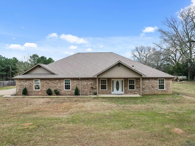 2888 Fm 593, Gilmer, TX 75644 - single story home with brick siding, a front yard, and a shingled roof