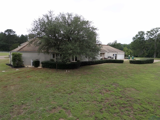 view of home's exterior featuring a yard