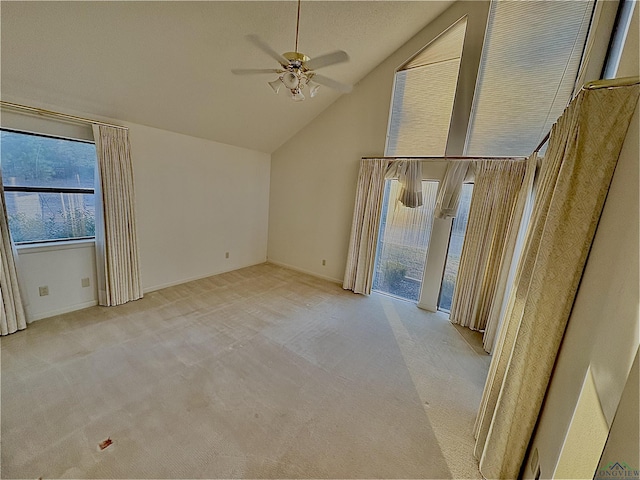 interior space featuring lofted ceiling and ceiling fan