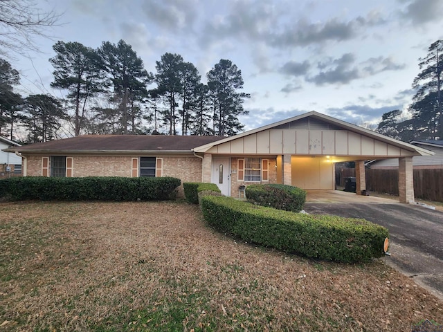 ranch-style home with a carport