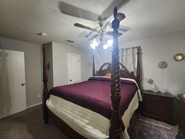 carpeted bedroom featuring a textured ceiling and ceiling fan