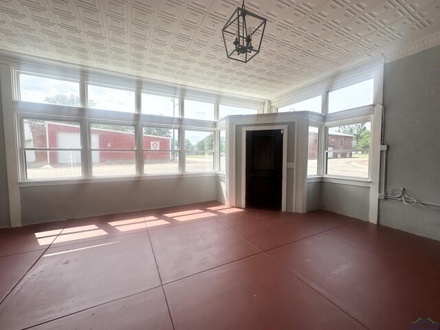 unfurnished sunroom featuring a healthy amount of sunlight