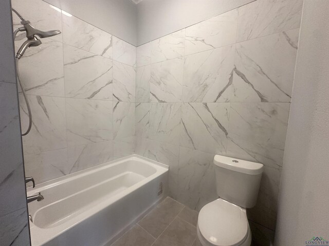 full bathroom with toilet, washtub / shower combination, and tile patterned flooring