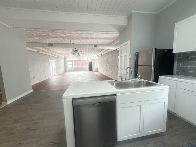 kitchen featuring a sink, stainless steel appliances, dark wood-style floors, and white cabinetry