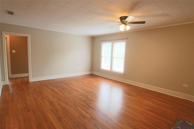 unfurnished room with ceiling fan, wood-type flooring, and crown molding