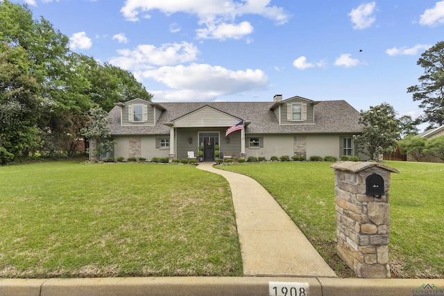 view of front of home featuring roof with shingles and a front lawn