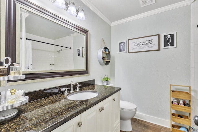 bathroom with visible vents, crown molding, wood finished floors, toilet, and baseboards