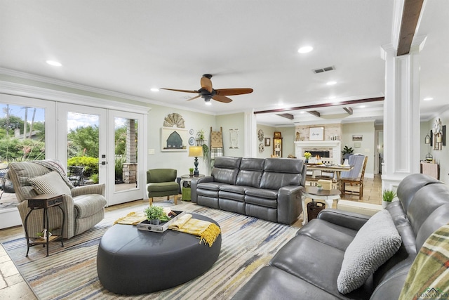 living room with crown molding, ceiling fan, visible vents, and french doors