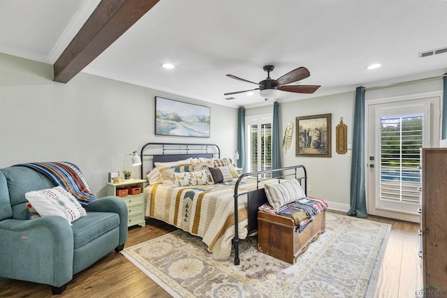 bedroom featuring visible vents, crown molding, multiple windows, and access to exterior