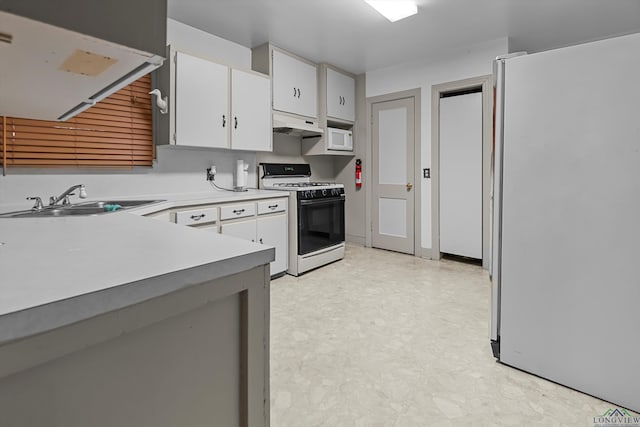 kitchen with sink, white appliances, and white cabinets